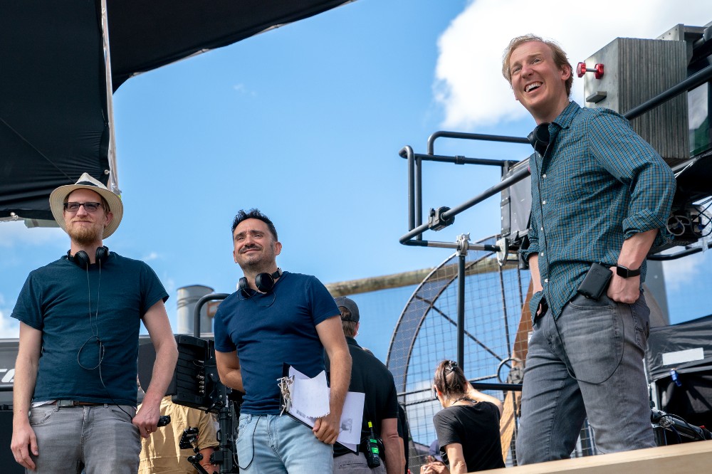 J.A. Bayona (center) with showrunners Patrick McKay (L) and JD Payne (r) on the set of Lord of the Rings: The Rings of Power / Prime Video (photo by Ben Rothstein)